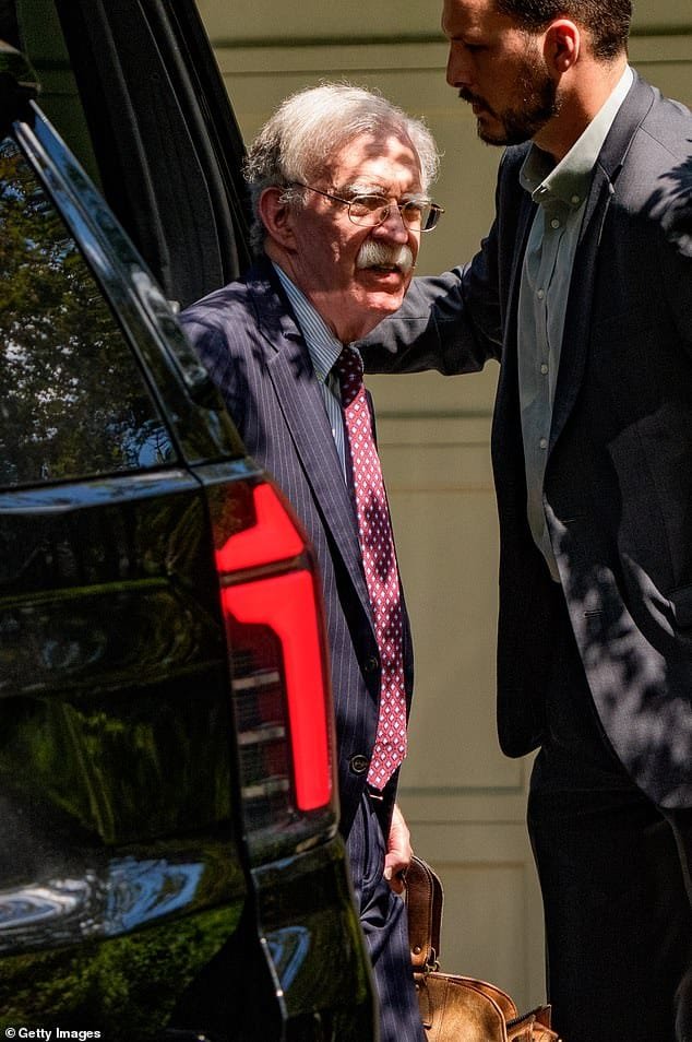 101475545-15026109-John_Bolton_arrived_to_his_house_after_a_nearly_eight_hour_raid_-a-19_1755896006341.jpg