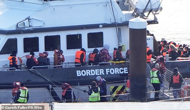 102845057-15177515-Migrants_arrive_aboard_a_Border_Force_vessel_at_Dover_on_Wednesd-a-239_1760021921980.jpg