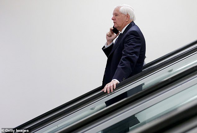 107530655-15691583-Lindsey_Graham_speaks_on_the_phone_as_he_walks_through_the_senat-a-16_1774888347813.jpg