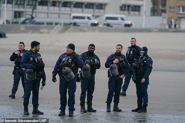 107862363-15731423-French_police_watch_on_yesterday_as_dozens_of_migrants_depart_fr-a-1_1776156142454.jpg